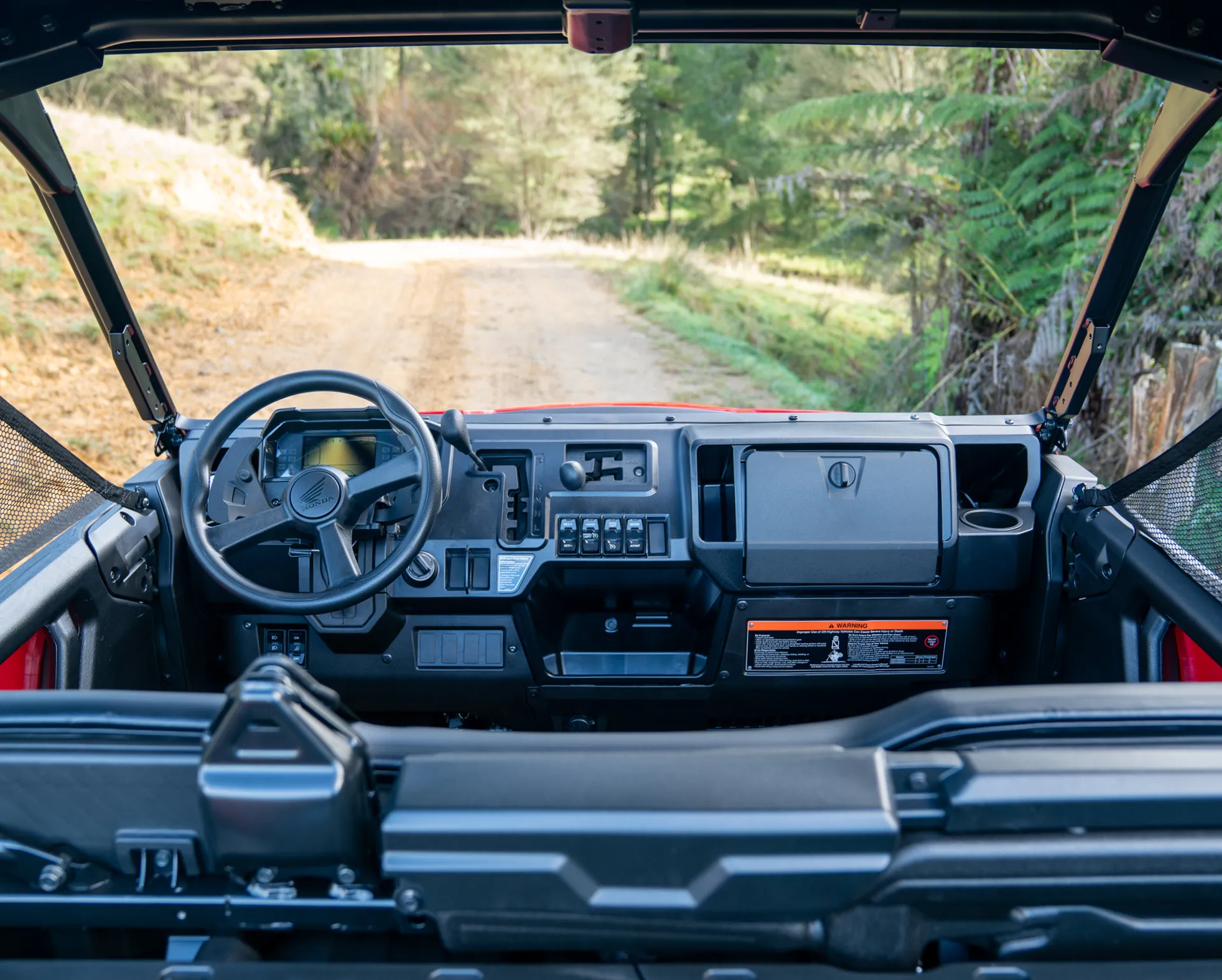 Honda Pioneer 1000 driver cockpit with Throttle-by-Wire controls and drive-mode selector